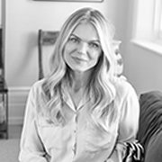 Black and white Agy Jarzebska posing with a smile